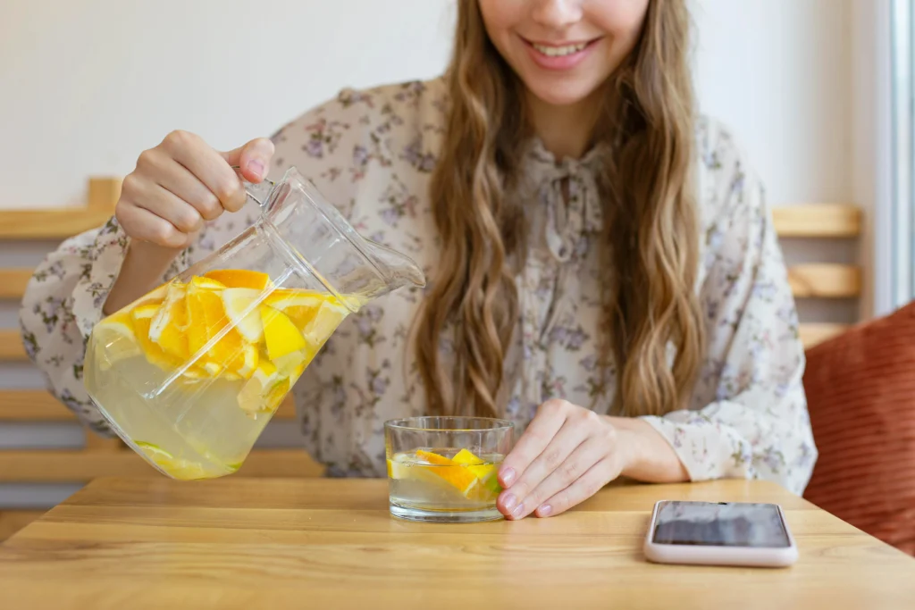 This image can be used to illustrate healthy hydration habits, promote detox or weight loss drinks (like lemon balm water), or support content related to wellness, self-care routines, or refreshing beverages.