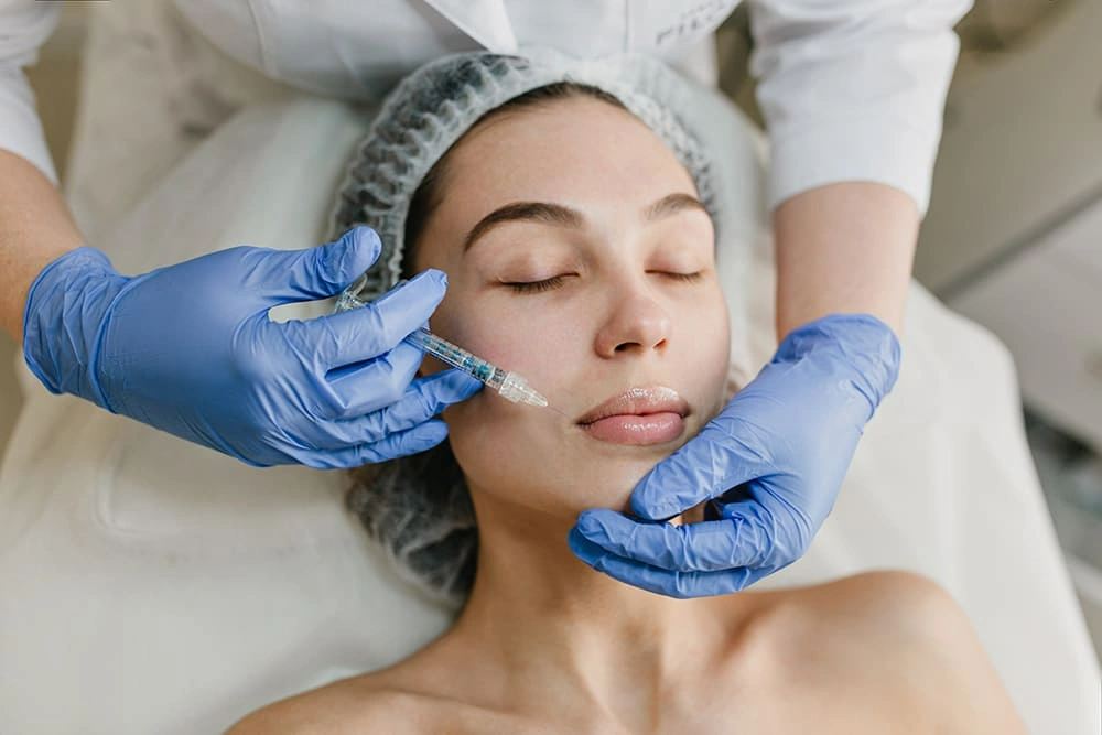 Woman receiving Botox injection on face at a clinic